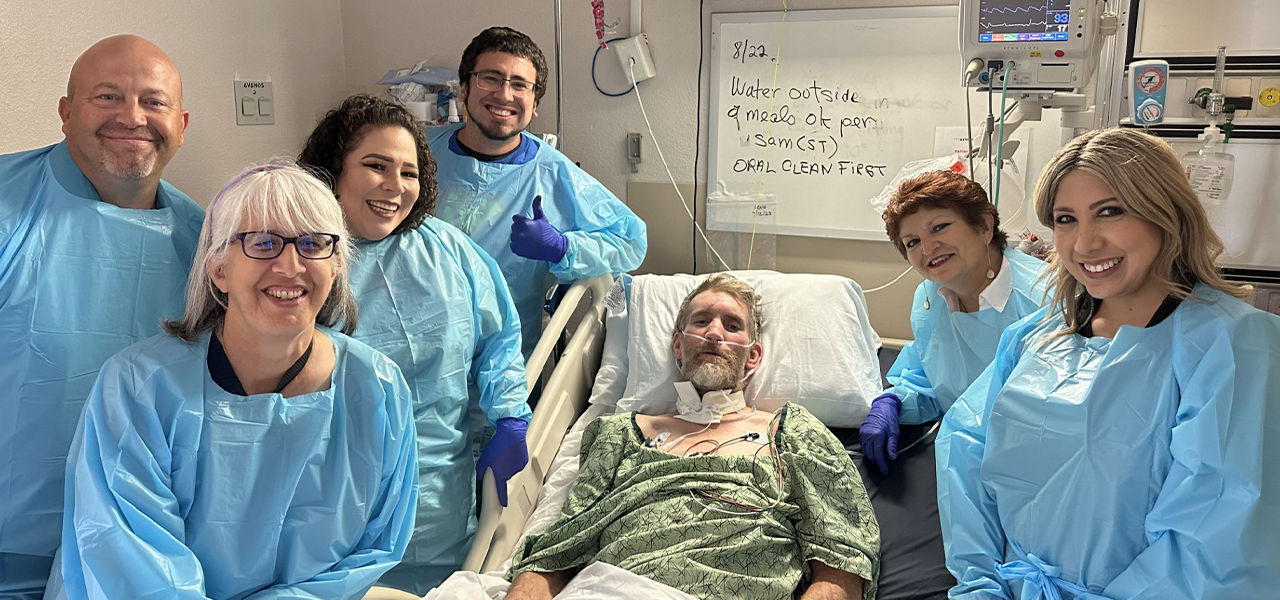 Happy patient leaving hospital with caregivers