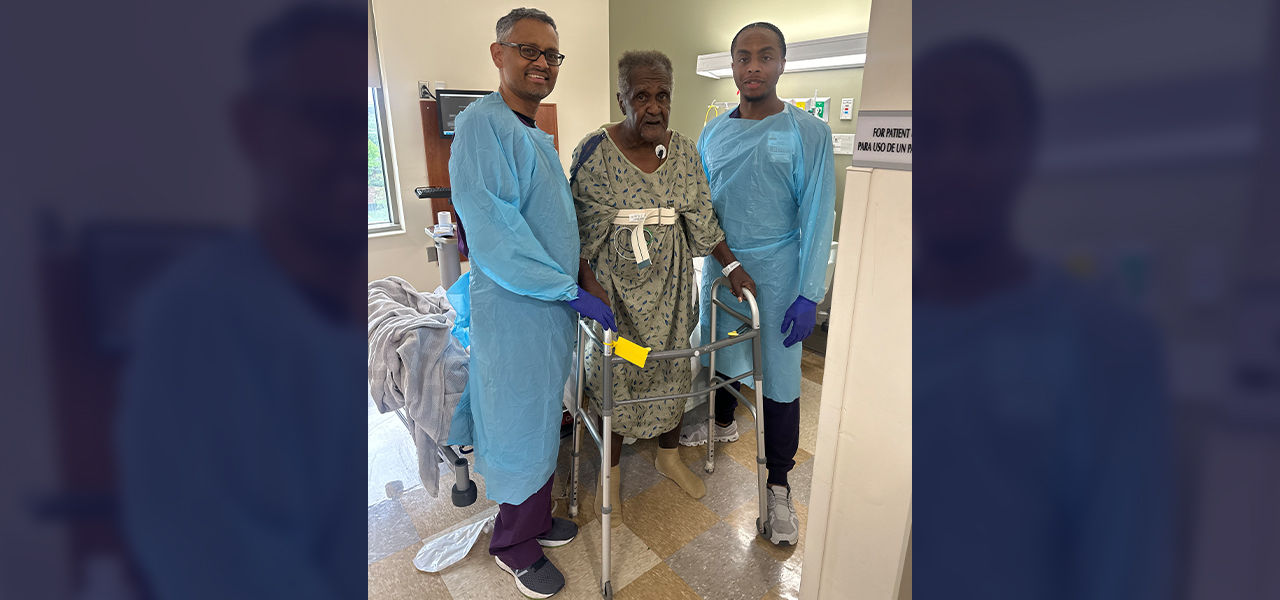 Happy patient leaving hospital with caregivers